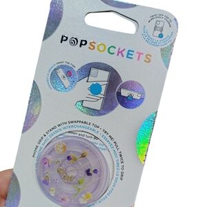 PopSocket Phone Grip and Stand With Swappable Top Purple With Flowers .